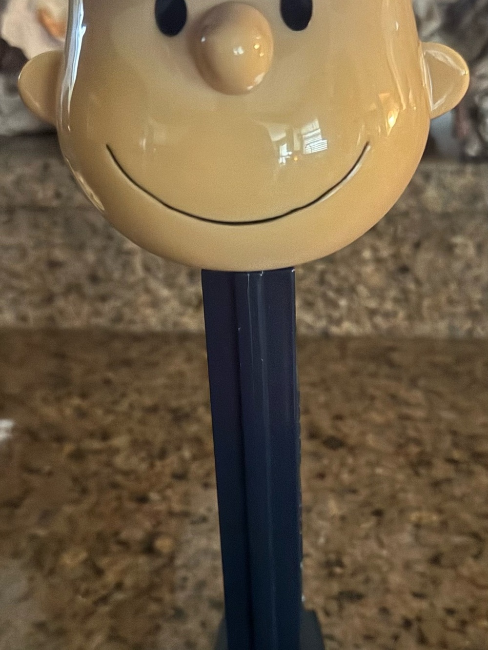 Smiling Yankee Charlie Brown candy dispenser